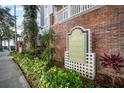 Community signage for Hyde Park Walk surrounded by meticulous landscaping at 800 S Dakota Ave # 221, Tampa, FL 33606