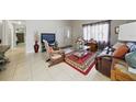 Comfortable living room features tile floors and a view of the front door at 9122 Suffield Ct, Tampa, FL 33615