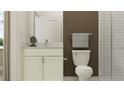 Bright bathroom featuring tile floors, white cabinets, solid surface counters, and shower with white subway tiles at 9314 Gladsome Dr, Land O Lakes, FL 34637