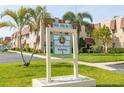 Entrance to Long Bayou Building 3, a condo community with tropical landscaping at 10034 64Th N Ave # 14, St Petersburg, FL 33708