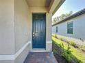 Attractive front door with decorative trim at 120 Moscata Way, Nokomis, FL 34275