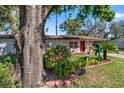 Cozy home with an inviting front yard and colorful landscaping, perfect for curb appeal at 202 New Hope Rd, Brandon, FL 33510