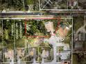 Aerial view of the property showing its lot lines and proximity to surrounding neighborhood and conservation areas at 2302 Azalea Dr, Palm Harbor, FL 34683