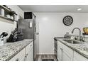 Efficient kitchen featuring granite countertops, stainless steel appliances, and ample storage at 36750 Us 19 N # 17106, Palm Harbor, FL 34684