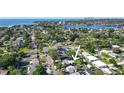 An aerial view of the property showcasing its location near water and mature tree cover at 4126 Harrisburg Ne St, St Petersburg, FL 33703