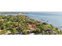 A prime waterfront property offers a tranquil escape with lush surroundings, stunning water views, and easy access to the bay at 6305 Bahama Shores S Dr, St Petersburg, FL 33705