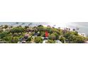 Beautiful waterfront property with lush greenery, picturesque docks, and serene water views, creating an idyllic coastal retreat at 6305 Bahama Shores S Dr, St Petersburg, FL 33705