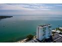 Beautiful aerial view of the waterfront condo building with stunning ocean and coastal scenery at 7200 Sunshine Skyway S Ln # 3D, St Petersburg, FL 33711