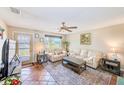 Inviting living room with comfortable seating and lots of natural light at 7509 Mitchell Ranch Rd, New Port Richey, FL 34655