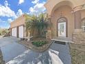 Welcoming front entrance features a decorative fountain and glass front door at 9711 Wydella St, Riverview, FL 33569