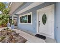 Close-up of front door featuring an oval window and modern hardware at 1039 23Rd St, Sarasota, FL 34234