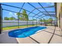Enjoy this in-ground screened pool with an adjacent jacuzzi, perfect for relaxation and outdoor entertaining at 12442 Curry Dr, Spring Hill, FL 34609