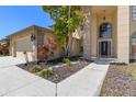 Beautiful front entrance with a well-manicured garden and a modern doorway at 12929 Prestwick Dr, Riverview, FL 33579