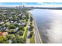 Scenic aerial view of the city skyline along the waterfront, with lush greenery at 1301 S Howard Ave # B24, Tampa, FL 33606
