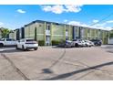 Two-story apartment building with ample parking and lush landscaping on a sunny day at 1301 S Howard Ave # B24, Tampa, FL 33606