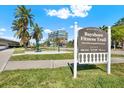 Bayshore Fitness Trail sign with palm trees and exercise equipment under a blue sky at 1301 S Howard Ave # B24, Tampa, FL 33606