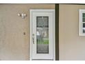 Elegant front door with decorative glass, adding a touch of sophistication to the entry at 16064 Dawnview Dr, Tampa, FL 33624