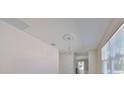 Bright, neutral interior featuring elegant chandelier and a clear view into other rooms at 2807 W Granfield Ave, Plant City, FL 33563