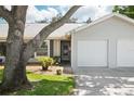Charming single-story home featuring a one-car garage, well-kept lawn, and delightful curb appeal at 39650 Us Highway 19 N # 615, Tarpon Springs, FL 34689