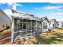 Cozy screened porch overlooking the lush backyard, perfect for relaxing outdoors at 5159 Sterling Manor Dr, Tampa, FL 33647