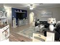 Open living room with hardwood floors, a navy accent wall, and a comfortable seating arrangement at 6701 Medlar Dr, New Port Richey, FL 34653