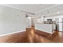 Spacious living room flowing into kitchen with stainless steel appliances and breakfast bar at 700 S Harbour Island Blvd # 240, Tampa, FL 33602