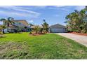 Traditional single-story home with a two-car garage and a well-manicured lawn, showcasing its curb appeal at 8032 13Th S Ave, St Petersburg, FL 33707