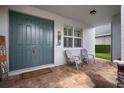 Inviting front porch features double doors, brick pavers, and comfortable seating at 8141 Carlton Ridge Dr, Land O Lakes, FL 34638