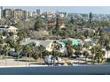 Charming neighborhood with a mix of colorful houses, palm trees, and distant water views at 880 Mandalay Ave # S514, Clearwater Beach, FL 33767