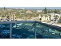 View from balcony showing the parking lot and the community near the water at 880 Mandalay Ave # S514, Clearwater Beach, FL 33767