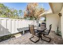 Back patio with seating, privacy fence, and a lovely outdoor space for entertaining or relaxing at 1333 Shady Pine Way # B, Tarpon Springs, FL 34688