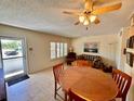 Cozy living area with tile flooring, a ceiling fan, and plenty of natural light at 2370 Jamaican St # 46, Clearwater, FL 33763