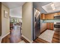 Kitchen featuring wooden cabinets, stainless steel appliances and view to the living room at 3076 Eastland Blvd # 305, Clearwater, FL 33761