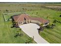 Sprawling ranch-style house on a large lot, complete with landscaping, palm trees, and fenced backyard at 3487 Recurve Cir, Sarasota, FL 34240