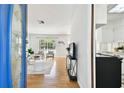 Inviting entryway with hardwood floors flowing into the sunlit living room at 3818 W San Miguel St, Tampa, FL 33629