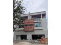 Under-construction exterior view showing the modern design with garage and window placements at 4509 W North A St # 1, Tampa, FL 33609