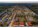 Aerial view of a waterfront residential community showcasing homes and canals at 9980 Eagles Point Cir # 1, Port Richey, FL 34668