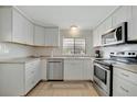 Well-equipped kitchen with stainless steel appliances and ample countertop space at 110 E Saint Lucia Loop, Apollo Beach, FL 33572