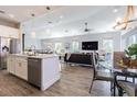 Spacious living room with open floor plan and modern decor, flowing into the kitchen at 16 Franklin S Ct # A, St Petersburg, FL 33711