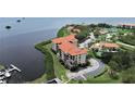 Waterfront condo with community tennis court, boat slips, and lush landscaping at 1810 Mariner Dr # 207, Tarpon Springs, FL 34689