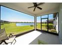 Relaxing screened-in lanai with views of the serene lake at 19212 Iron Topsail Isle, Land O Lakes, FL 34638