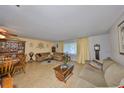Comfortable living room with hardwood floors, neutral colors, and ample seating at 672 Allegheny Dr, Sun City Center, FL 33573