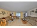 Comfortable living room with hardwood floors, neutral colors, and ample seating at 672 Allegheny Dr, Sun City Center, FL 33573