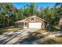 Charming single-story home with a well-maintained lawn, screened in porch and an attached two car garage at 7182 Griffin Rd, Brooksville, FL 34601
