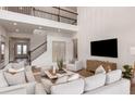 Bright living room boasts a large TV, comfortable seating, and stylish decor at 9825 Autumn Ridge Ave, Riverview, FL 33578