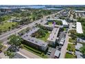 Aerial view of the condo community near the lake, showcasing its location and surrounding landscape at 9940 47Th N Ave # 210, St Petersburg, FL 33708