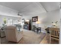 Cozy living room featuring neutral colors, plush seating, and natural light at 9940 47Th N Ave # 210, St Petersburg, FL 33708