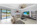 Cozy living room with comfortable seating, stylish decor, and access to the outdoor area at 11872 Thicket Wood Dr, Riverview, FL 33579