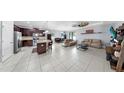 Open-concept layout connecting the kitchen, dining, and living areas creates a seamless flow for entertaining at 11872 Thicket Wood Dr, Riverview, FL 33579