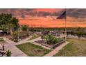 Scenic backyard deck perfect for outdoor entertaining with waterfront views at sunset at 12821 5Th Isle, Hudson, FL 34667